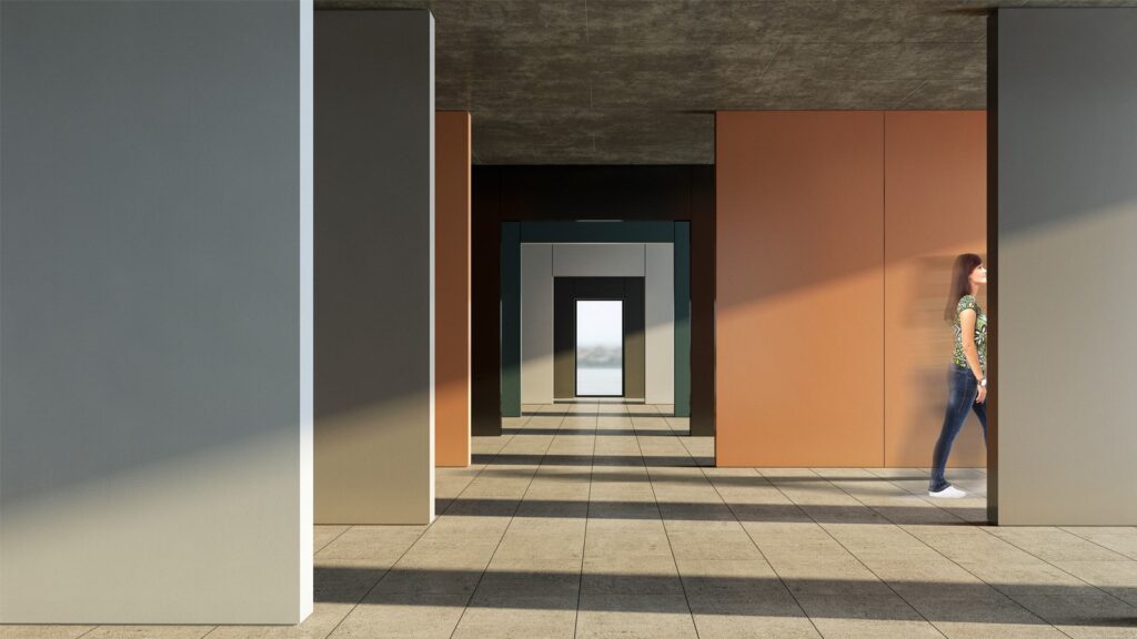 A modern interior space features a series of open doorways creating a visual corridor. Various earth-toned walls and natural light create patterns on the floor. A person wearing casual clothing walks through the space on the right side.